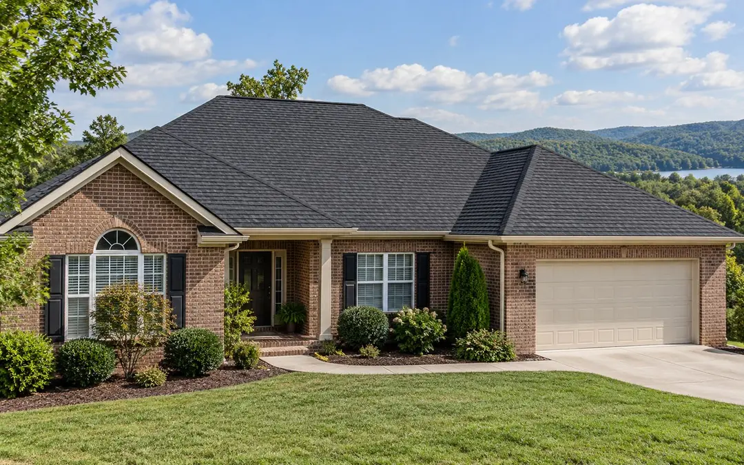 New charcoal shingle roof on a brick ranch home